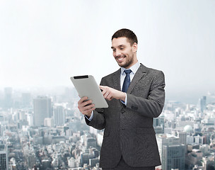 Image showing smiling buisnessman with tablet pc computer