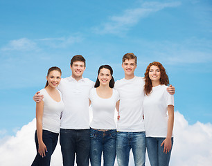 Image showing group of smiling teenagers in white blank t-shirts