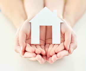 Image showing close up of woman and girl hands with paper house