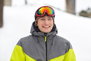 Image showing happy young man in ski goggles outdoors