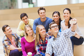 Image showing group of students with smartphone and coffee cup