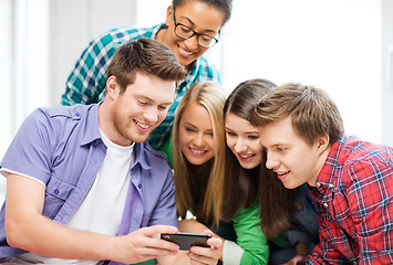 Image showing students looking at smartphone at school