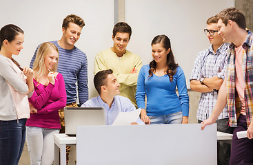 Image showing group of students and teacher with laptop