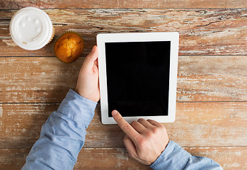 Image showing close up of male hands with tablet pc and coffee