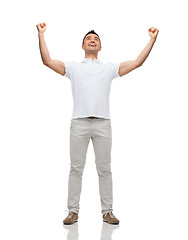 Image showing happy man with raised hands