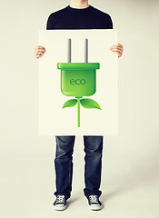 Image showing hands holding picture of green electrica ecol plug