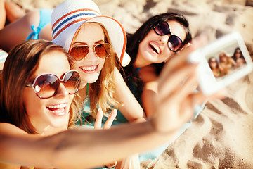 Image showing girls making self portrait on the beach