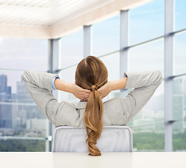 Image showing businesswoman sitting on chair from back