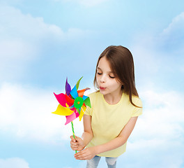 Image showing smiling child with colorful windmill toy