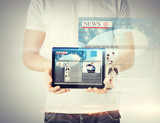 Image showing man showing tablet pc with news