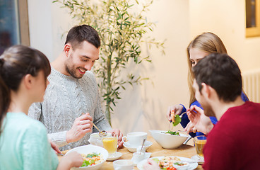 Image showing happy friends meeting and having dinner at cafe