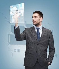 Image showing young businessman with smartphone