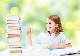 Image showing happy girl with books and notebook at school