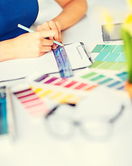 Image showing woman working with color samples for selection