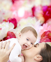 Image showing laughing baby playing with mother