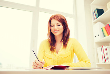 Image showing smiling businesswoman or student with tablet pc