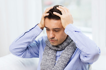 Image showing close up of ill man with flu and headache at home