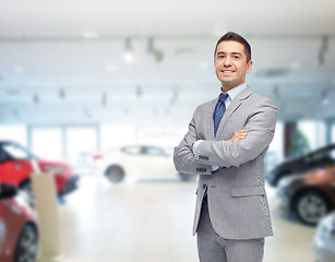 Image showing happy man at auto show or car salon