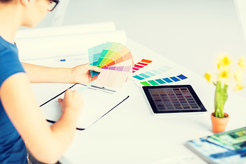 Image showing woman working with color samples for selection