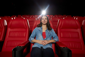 Image showing young woman watching movie in theater