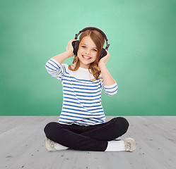 Image showing happy girl with headphones listening to music