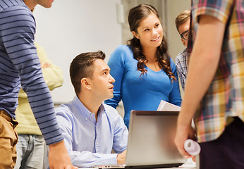 Image showing group of students and teacher with laptop