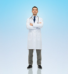 Image showing male doctor in white coat over blue background