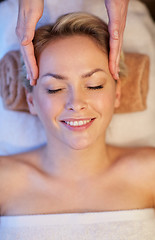 Image showing close up of woman having face massage in spa