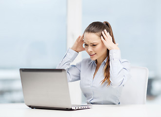 Image showing stressed woman with laptop