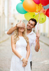 Image showing couple with colorful balloons