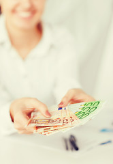 Image showing woman hands with euro cash money