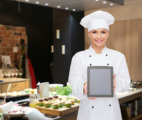 Image showing smiling female chef with tablet pc blank screen