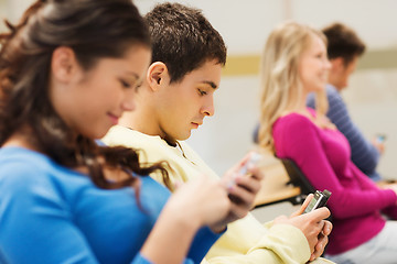 Image showing group of smiling students in lecture hall