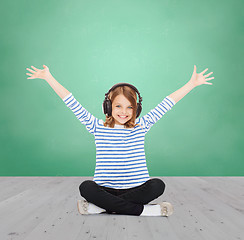 Image showing happy girl with headphones listening to music