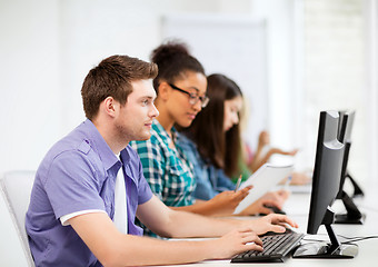 Image showing students with computers studying at school