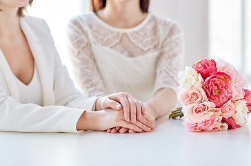 Image showing close up of happy lesbian couple with flowers