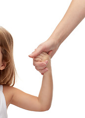 Image showing close up of woman and little girl holding hands