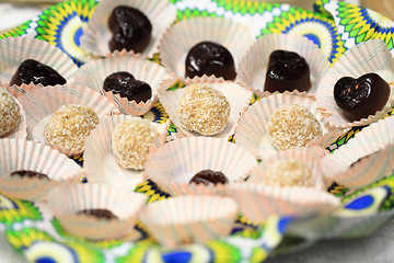 Image showing coconut spheres and chocolate dessert