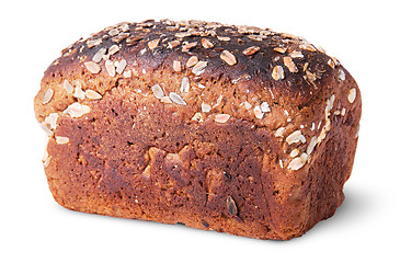 Image showing Unleavened black bread with seeds rotated top view