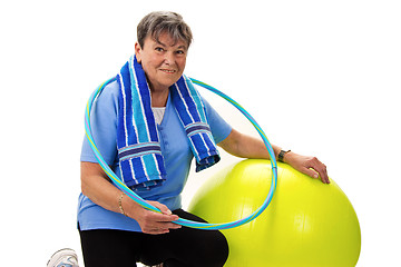 Image showing Senior woman with fitness ball and hula-hoop