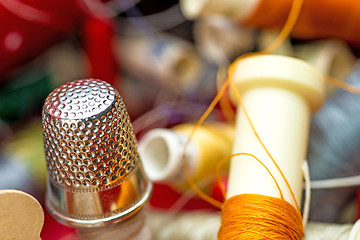 Image showing Thimble with thread