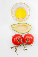 Image showing Top view to the tomatoes, avocado and olive oil