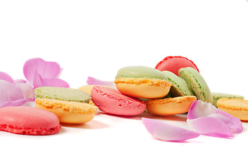 Image showing Pink rose petals and macaron cookies