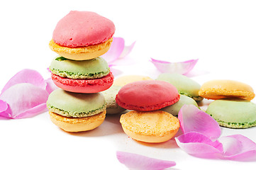 Image showing Macaron cookies and pink rose petals 