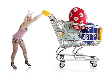 Image showing Easter bunny with colorful eggs in her shopping cart