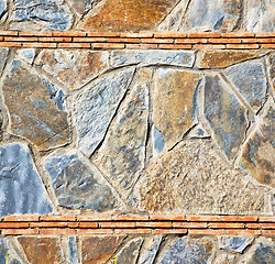 Image showing rocks stone and red orange gneiss in the wall of morocco