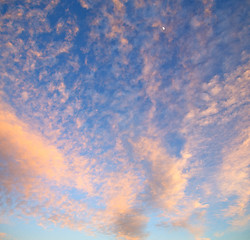 Image showing sunrise in the colored sky white soft clouds and abstract backgr