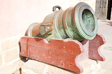 Image showing in africa morocco  green bronze cannon and the blue sky