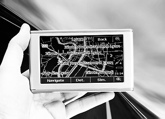 Image showing GPS Vehicle navigation system in a man hand.