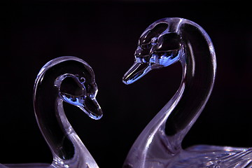 Image showing purple glass swans